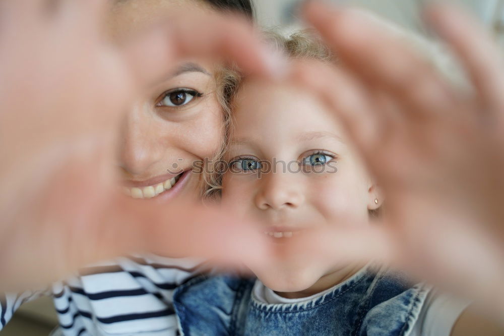 Similar – Image, Stock Photo mother and son playing with soap bubbles in park