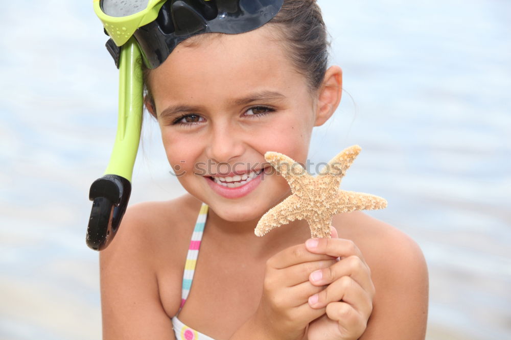 Similar – Image, Stock Photo Little girl holding starfish