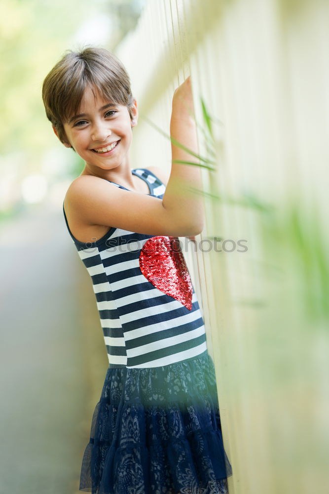 Little girl playing in a urban park