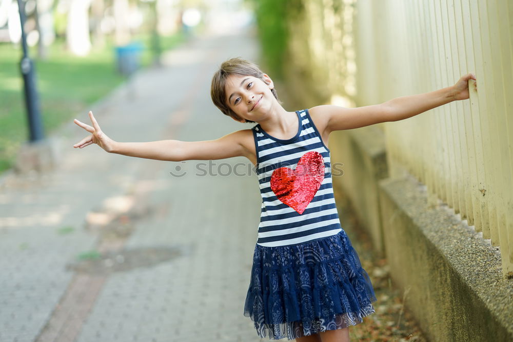 Similar – Image, Stock Photo Young girl with brown hair is playing outside.