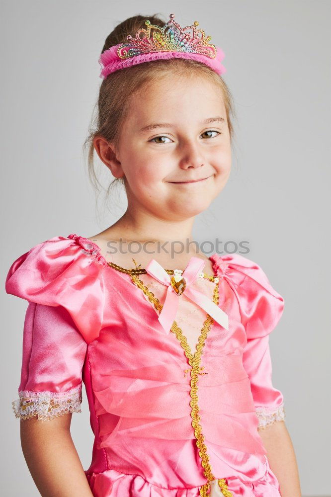 Similar – Little girl enjoying her role of princess. Adorable cute 5-6 years old girl wearing pink princess dress and tiara