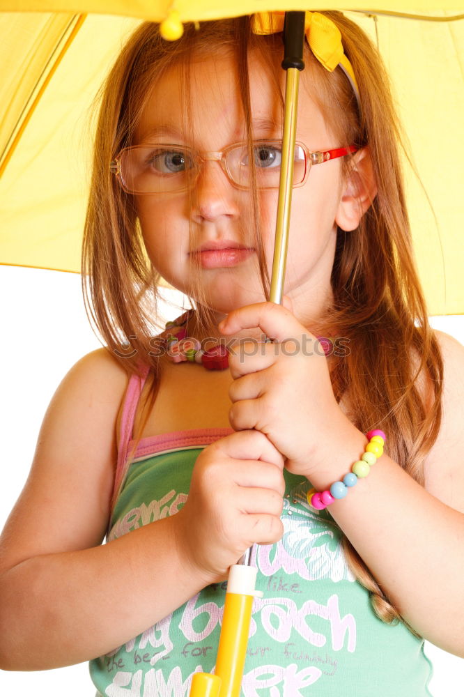 Similar – happy kid girl hiding under umbrella