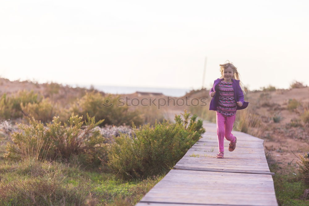 Similar – Low view of a young woman in nature