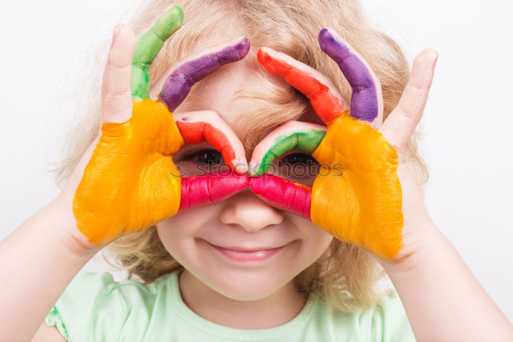 Similar – Girl with clown nose looks into the camera