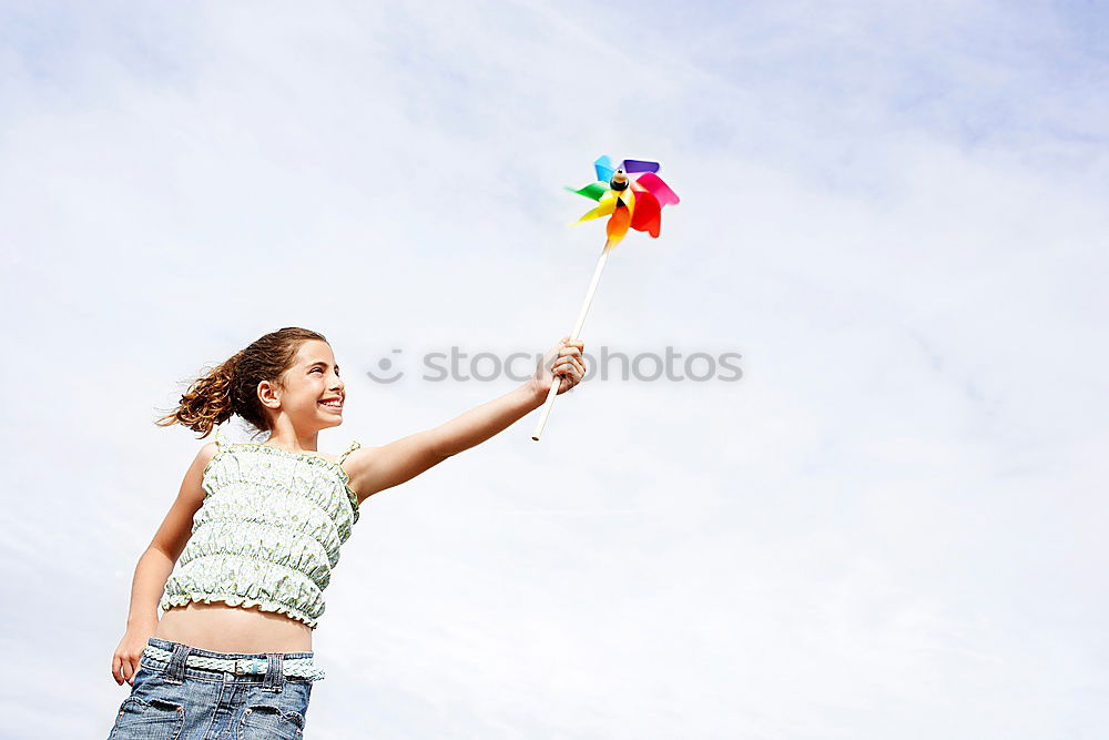 Similar – Image, Stock Photo A girl stretching arms and throwing Color powder