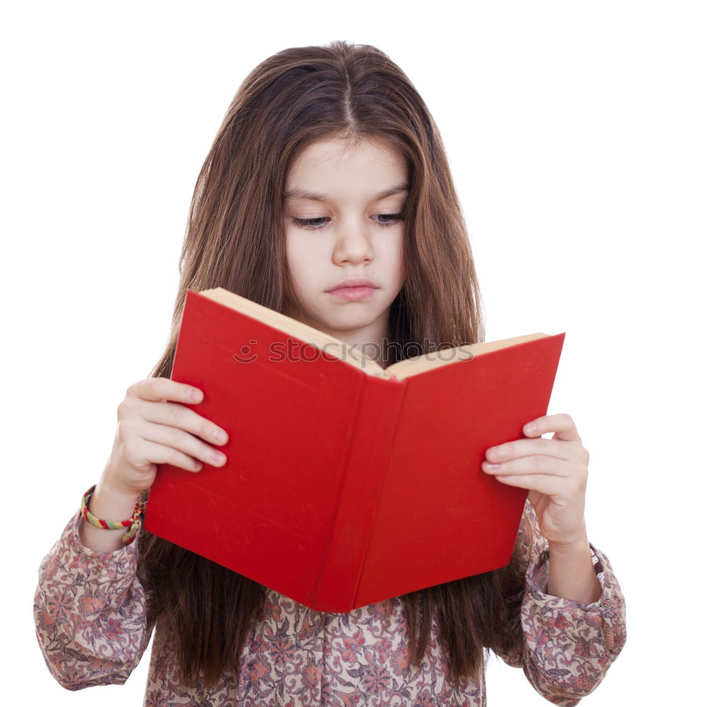 Similar – boy reading books on gray background