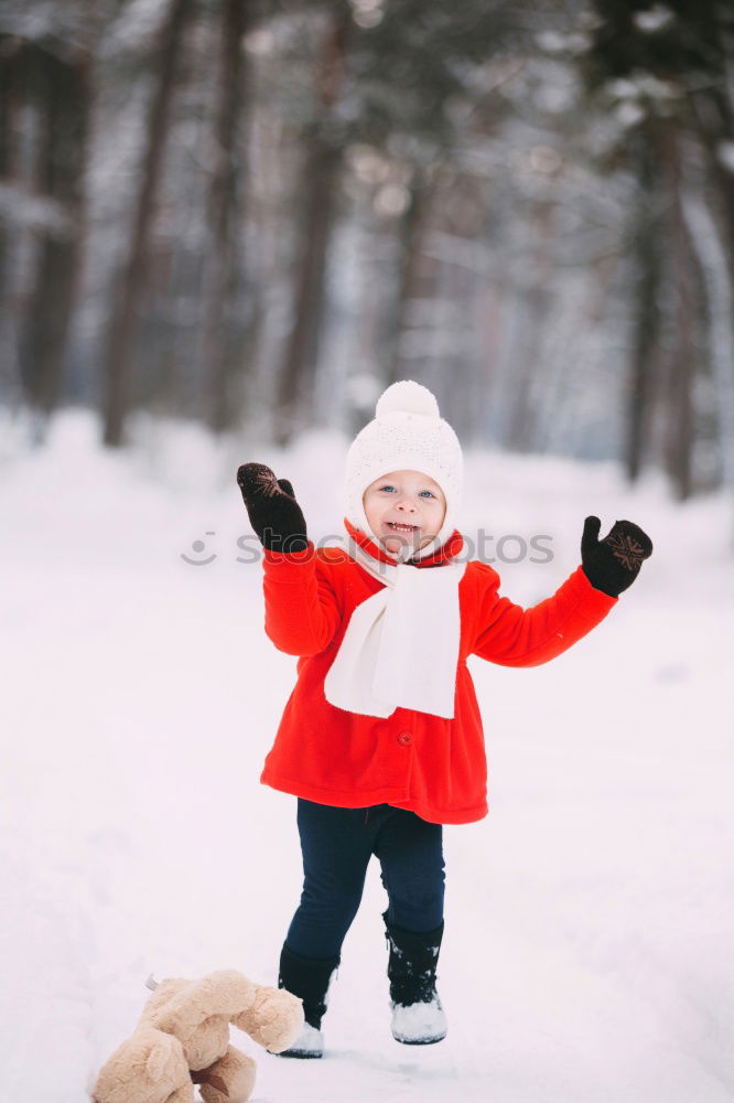 Similar – Mother is playing with her little daughter outdoors in winter