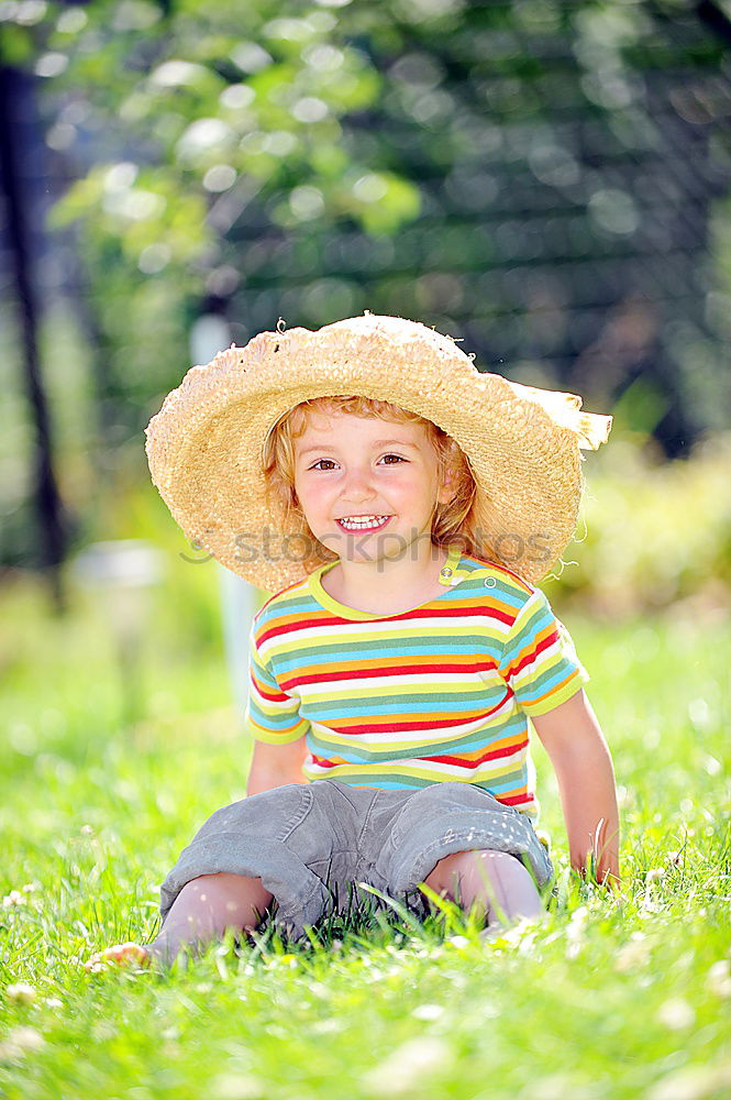 Similar – Child playing with toy tractor on meadow