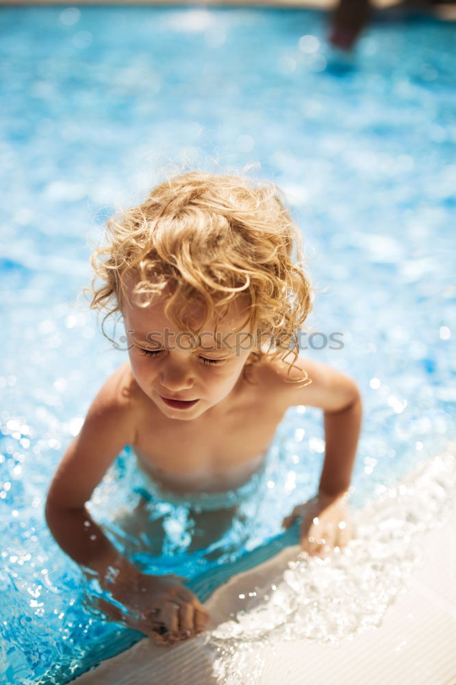 Similar – Kid in snorkel mask posing on poolside