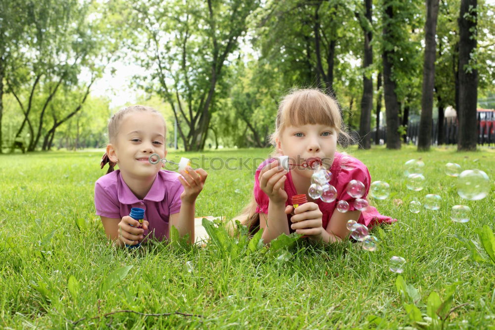 Similar – Image, Stock Photo Happy boy playing with soap bubbles in the park