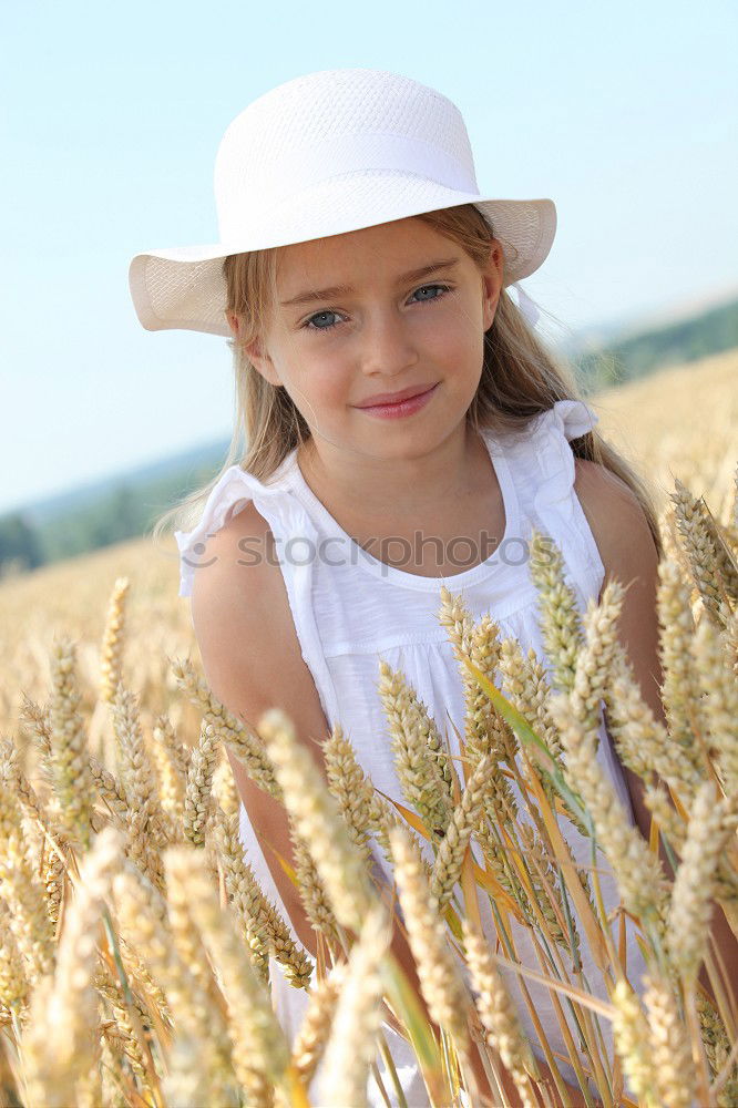 Image, Stock Photo smiling little girl holding wheat in hands