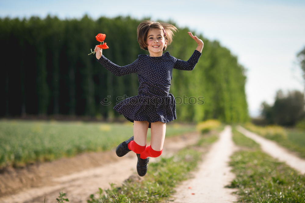 Similar – Image, Stock Photo Little girl in poppies field wearing beautiful dress