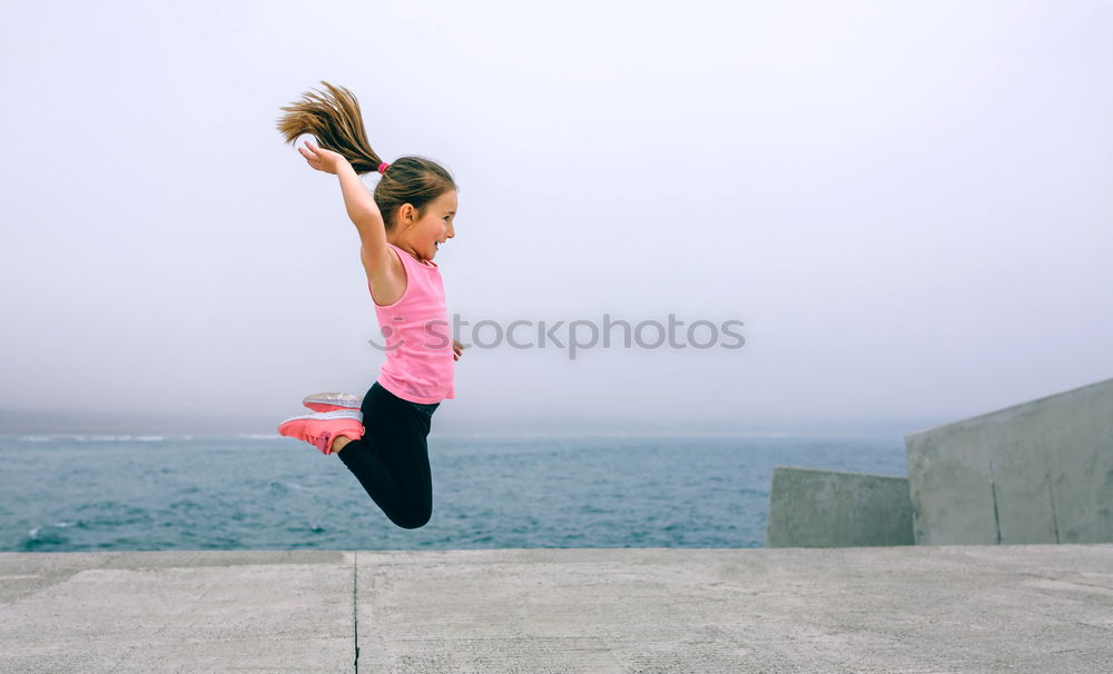 Image, Stock Photo Strong white woman jumping in the air during contemporary dance performing.