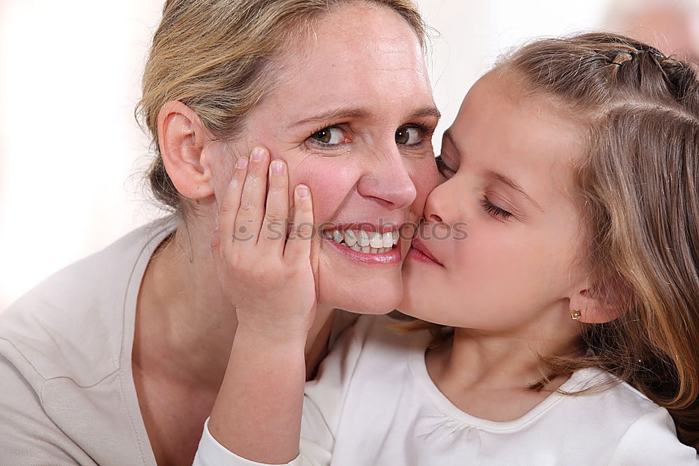 Similar – Image, Stock Photo Beautiful mother and daughter touching each other with their noses. Lovely family portrait