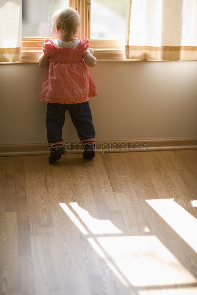 Similar – Baby and mom to the window