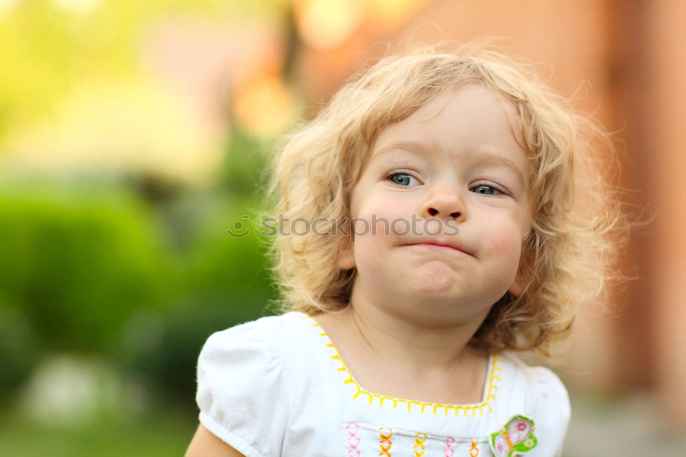 Similar – Girl pulls nose curly