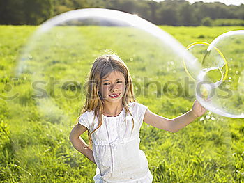 Similar – Image, Stock Photo Girl blowing balloon outside