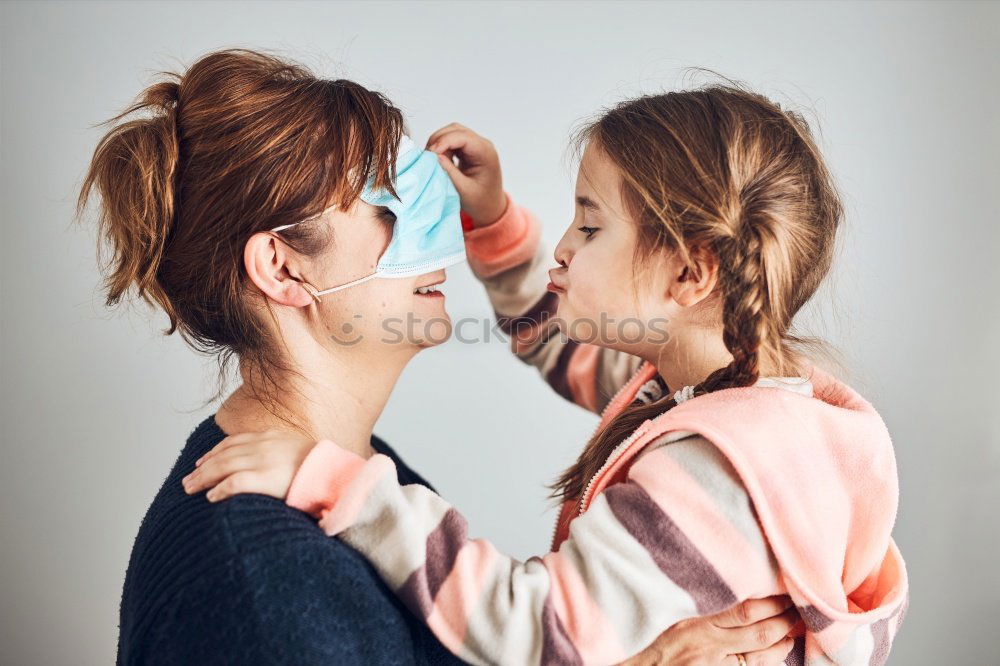 Similar – mother brushing toddler daughter’s hair