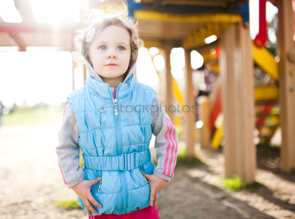 Similar – Little caucasian girl having fun on slide on playground