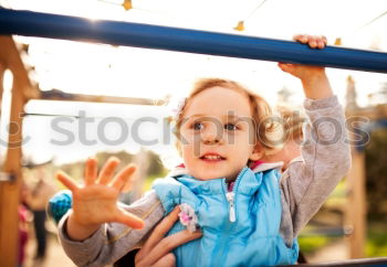 Similar – Image, Stock Photo Little cute girl swinging in a park on sunny spring day