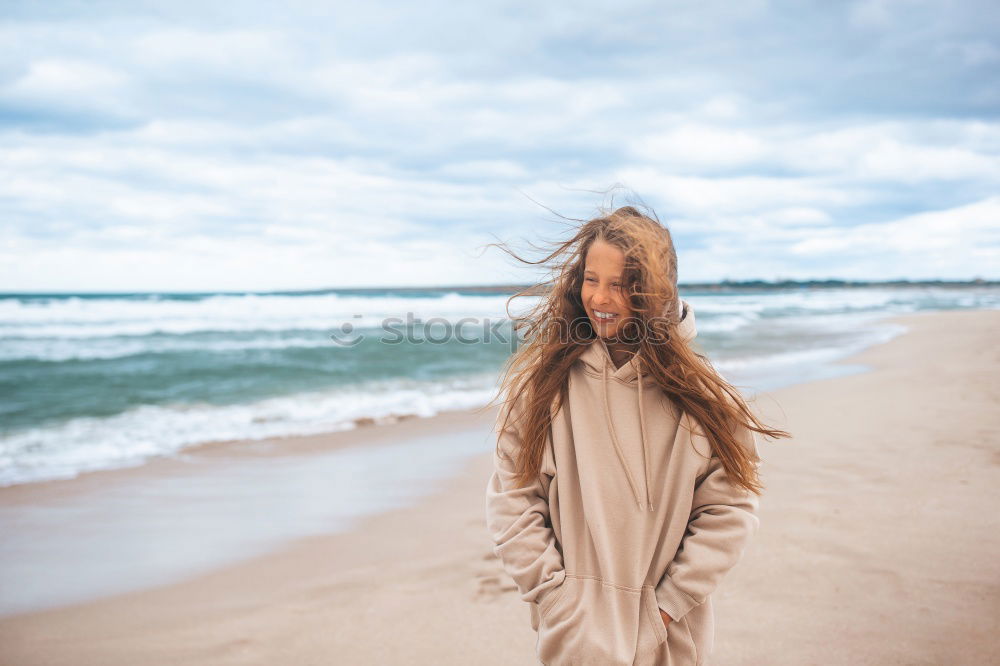 Similar – Image, Stock Photo Young Girl is sitting enjoying the view of the sunset at ocean