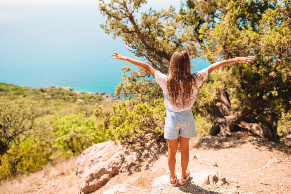 Similar – Stylish woman on picturesque landscape