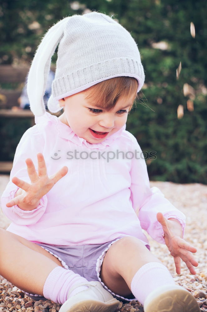 Similar – Little girl putting on her socks