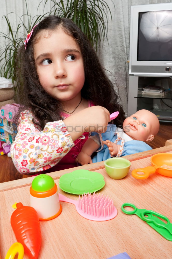 Similar – Woman feeding her little girl in kitchen