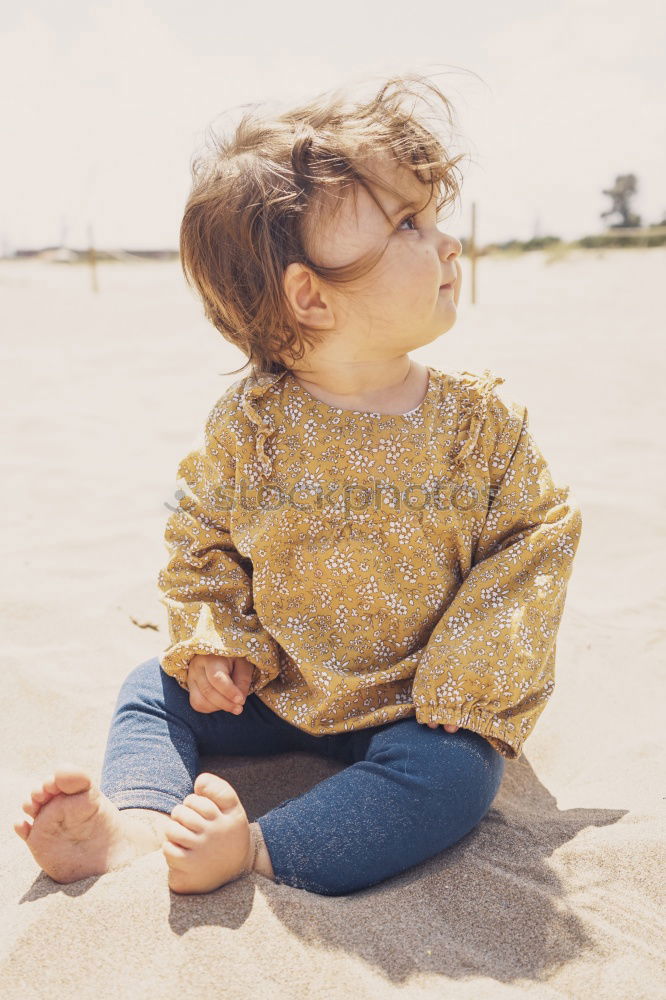 Similar – Image, Stock Photo child girl playing with stones on the beach