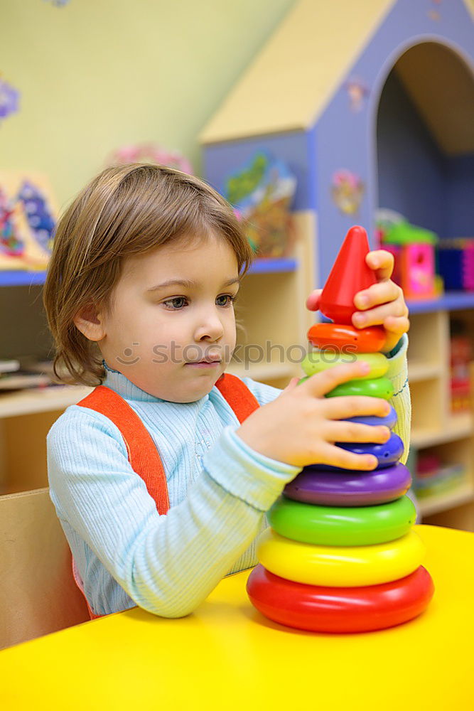 Similar – Happy baby playing with toy blocks.