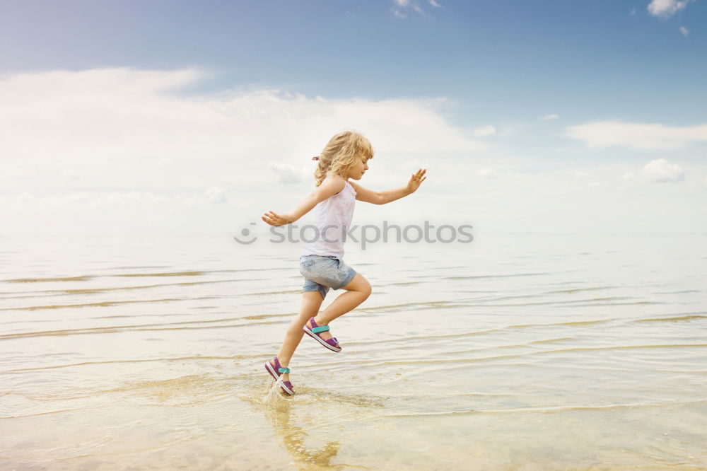 Similar – two sisters playing on the beach