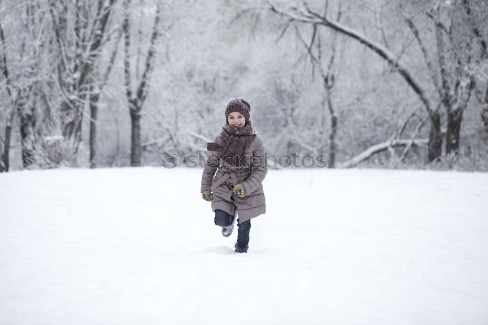 Similar – Cheerful woman having fun in winter forest