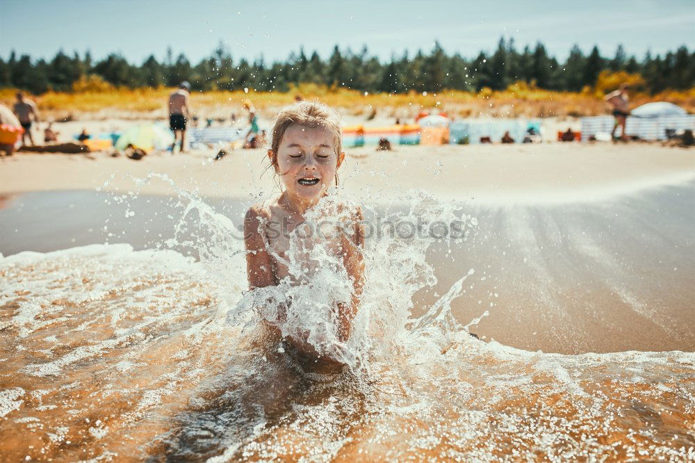 Similar – Image, Stock Photo Little kid playing and swimming on the sea