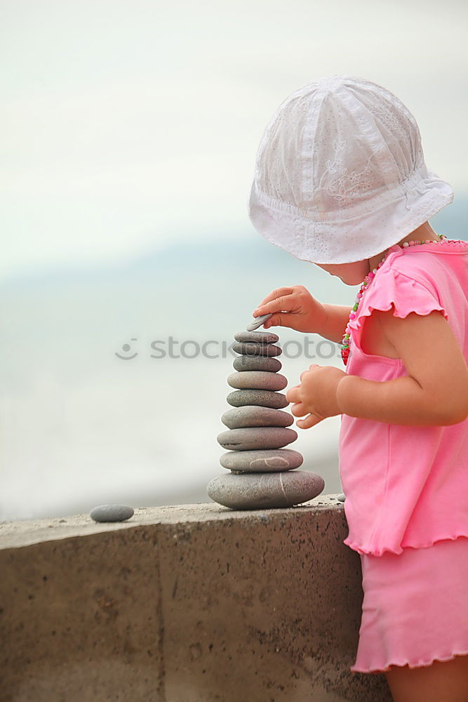 Similar – Image, Stock Photo child playing with sand