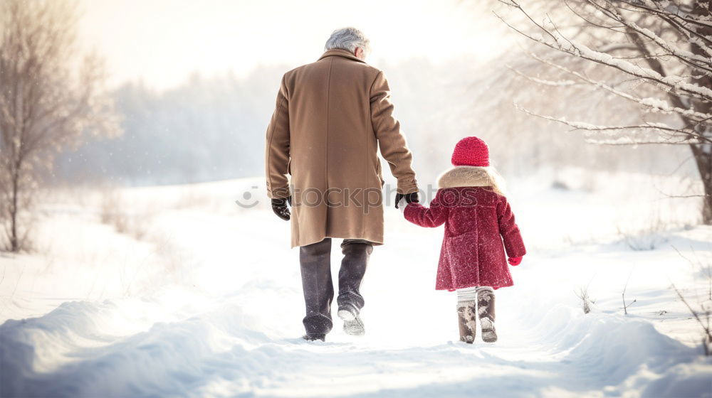 Similar – Mother and her daughter sitting on a bench on wintery day