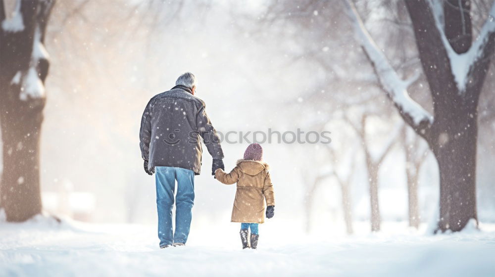 Teenage girl enjoying snow with her little sister