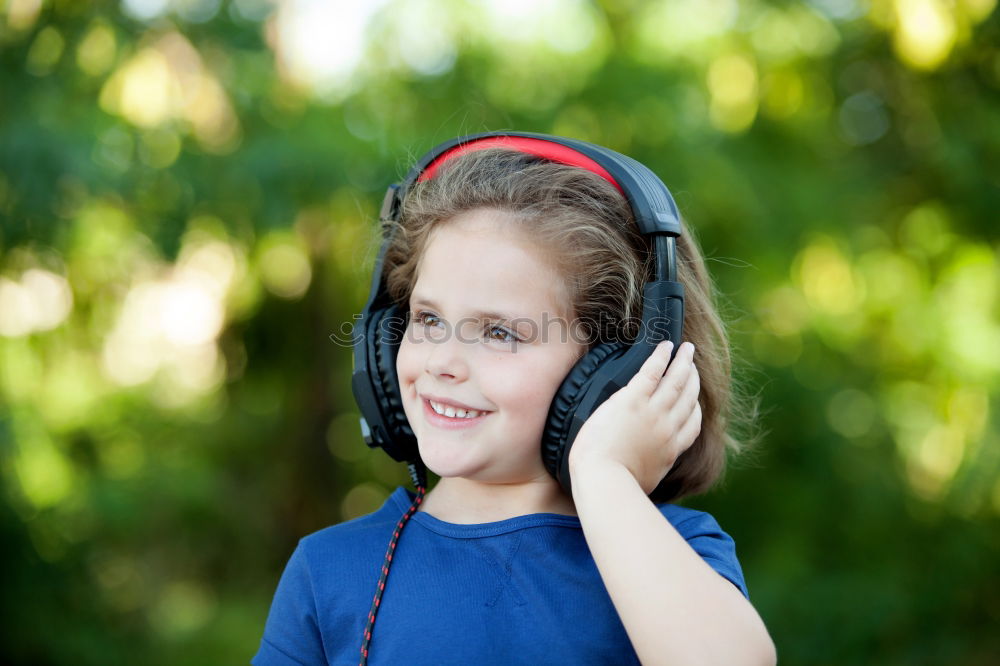 Similar – Image, Stock Photo Little girl with headphones outside