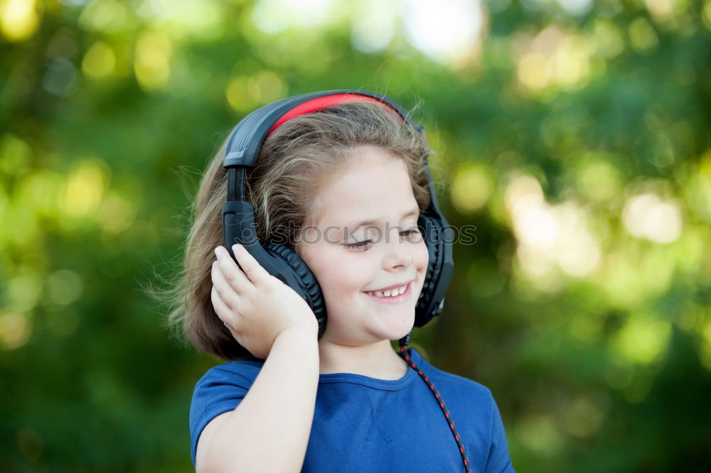 Similar – Image, Stock Photo Little girl with headphones outside