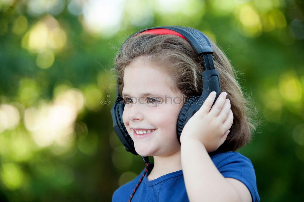 Similar – Image, Stock Photo Little girl with headphones outside