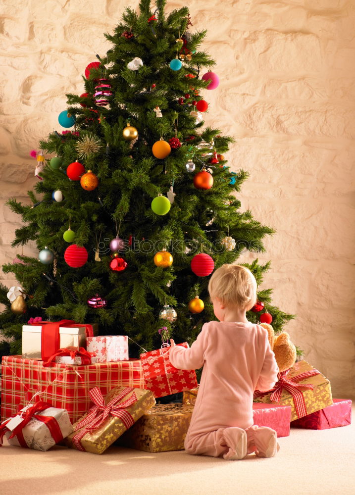 Similar – Young girl and her little sister decorating Christmas tree