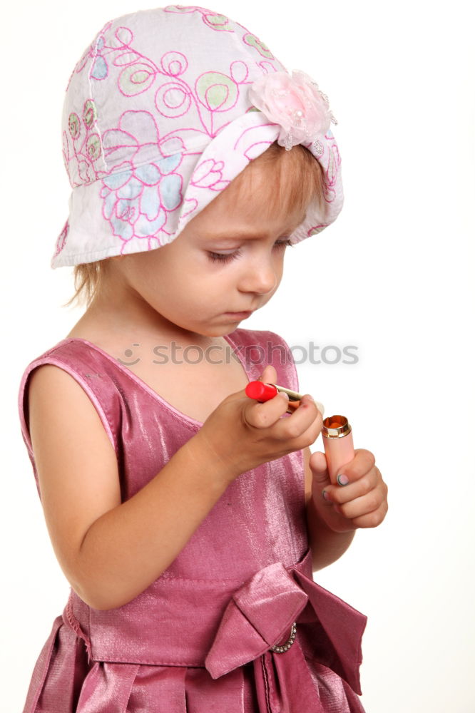 Similar – Little girl putting on her socks