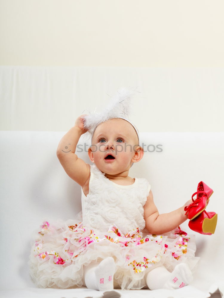 Similar – Image, Stock Photo Baby girl two months old looking at a doll
