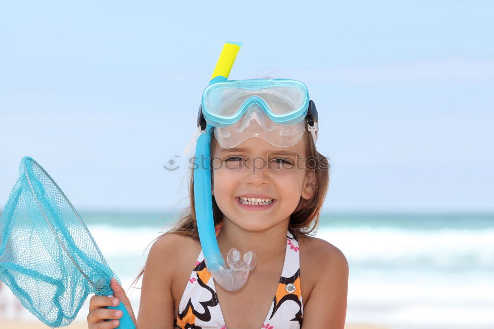 Similar – Kid in snorkel mask posing on poolside