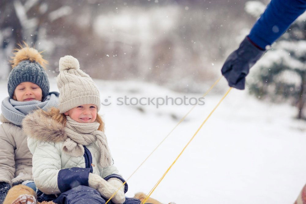 Similar – Image, Stock Photo Family spending time together outdoors in the winter. Parents with children gathered around the campfire preparing marshmallows and snacks to toasting over the campfire using wooden sticks