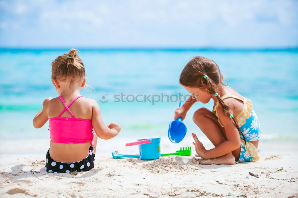 Similar – Two happy children playing on the beach