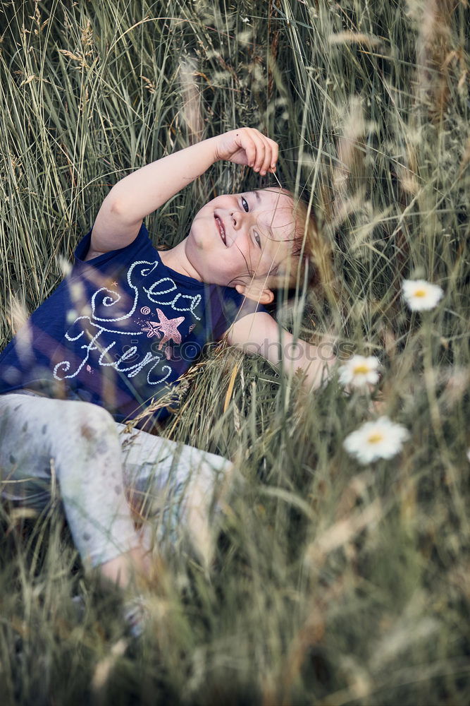 Similar – Young redhead hippie woman resting in nature