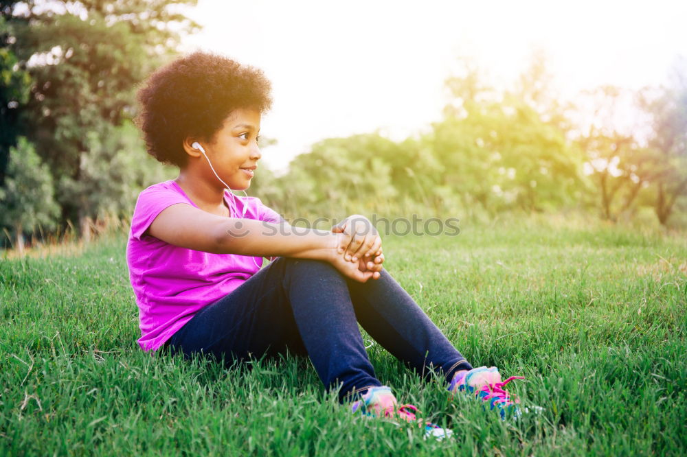 Similar – Young African American woman lying on grass