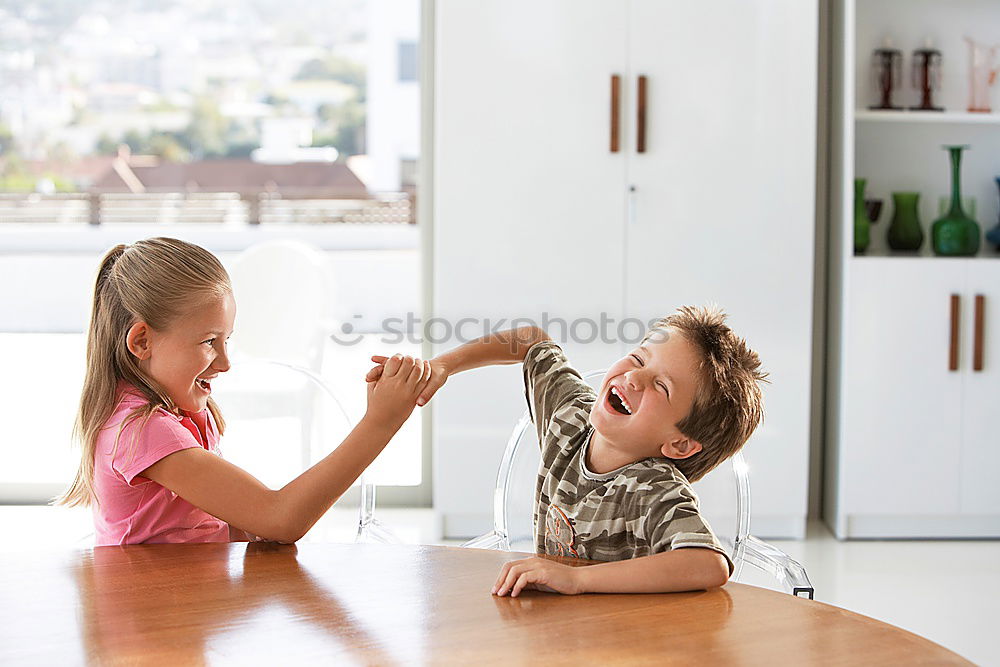 Similar – Portrait of two happy children sitting on the stairs