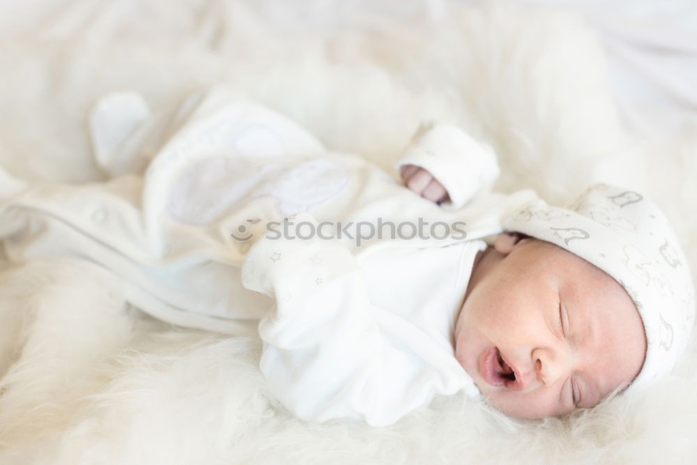 Similar – Portrait of a newborn baby sleeping