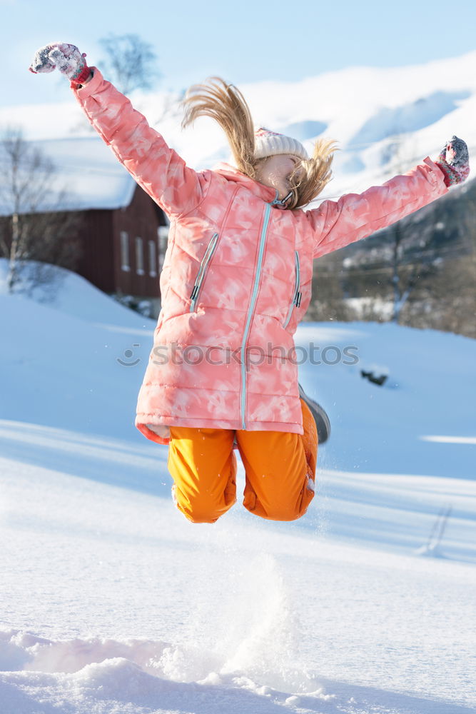 Similar – Mother enjoying the snow with her daughter outdoors